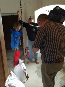 Ruth helps Miller Lloyd to lift the grain to the top of the Mill 